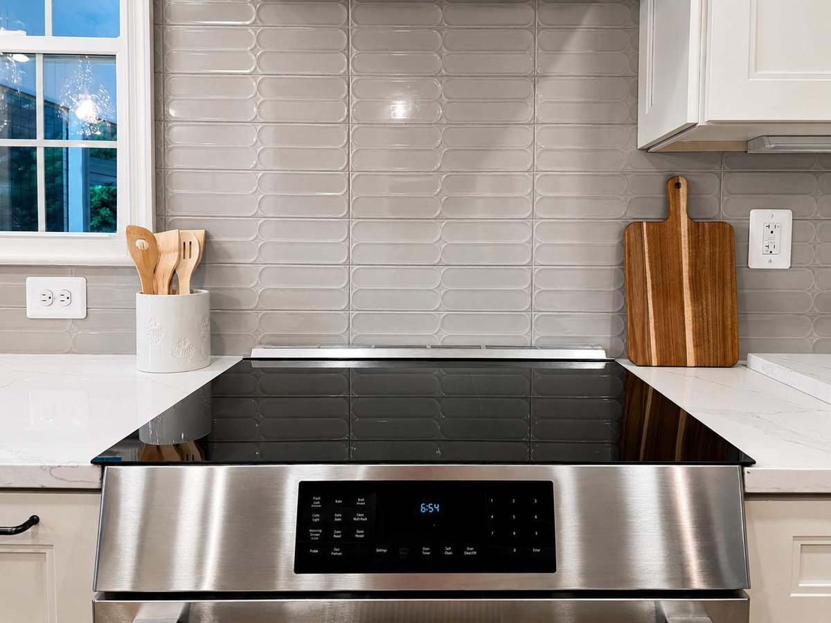 Tile and aluminum appliances in Burke kitchen remodel by Anchor Remodel