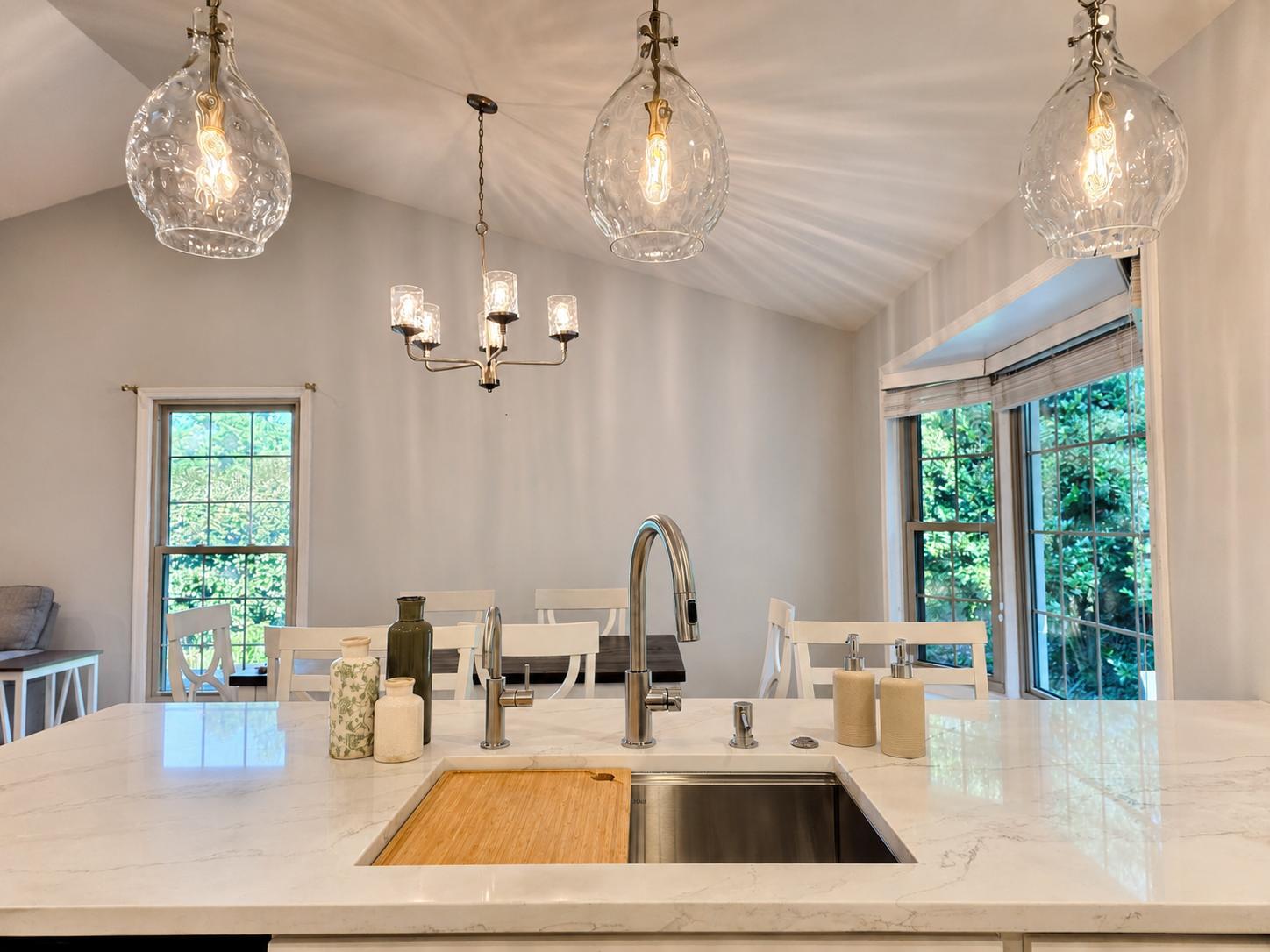 Kitchen tsink, white marble island, pendant lights in kitchen remodel in Burke