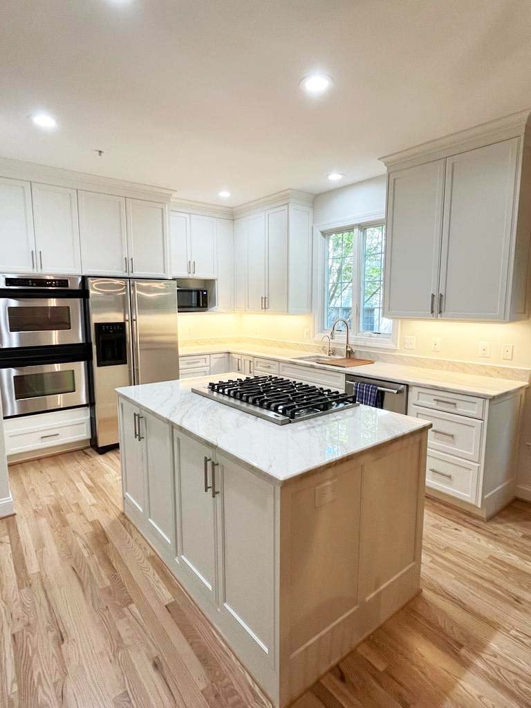 Anchor Remodel custom kitchen featuring spacious layout and gas cooktop island in McLean, VA.