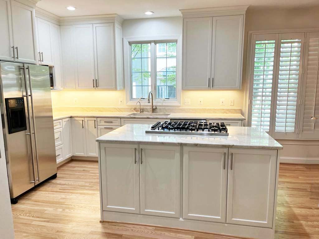 Full view of custom kitchen remodel with island and stainless steel appliances by Anchor Remodel in McLean, VA.