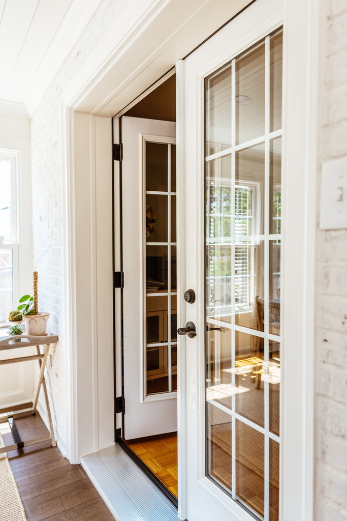 French doors leading from custom sunroom to interior space by Anchor Remodel in Alexandria, VA