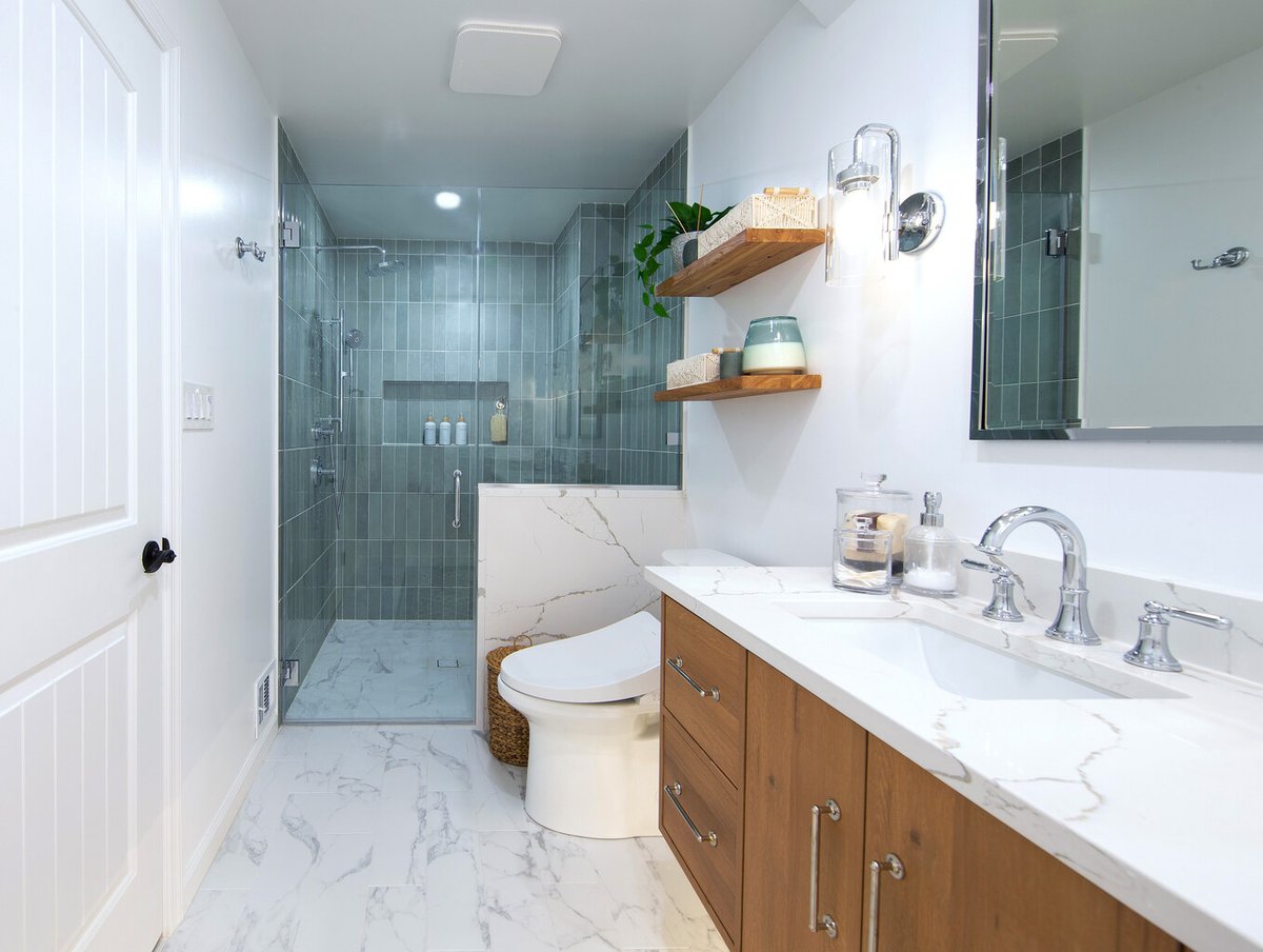 Modern custom bathroom with glass walk-in shower and wood vanity by Anchor Remodel in Vienna, VA.