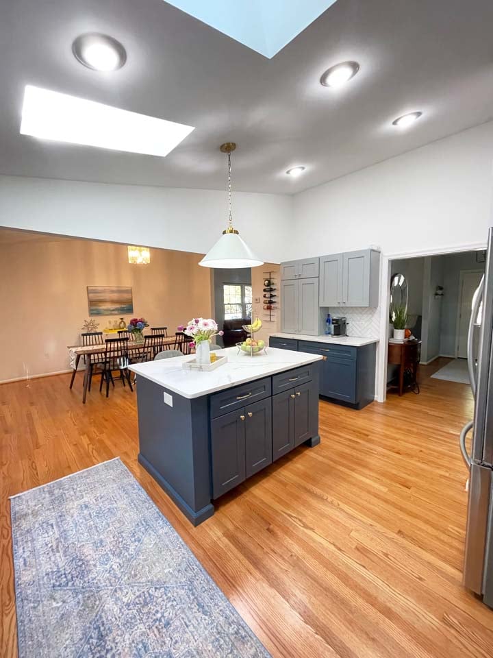 Anchor Remodel Springfield kitchen island view with pendant lighting and dining room in background.