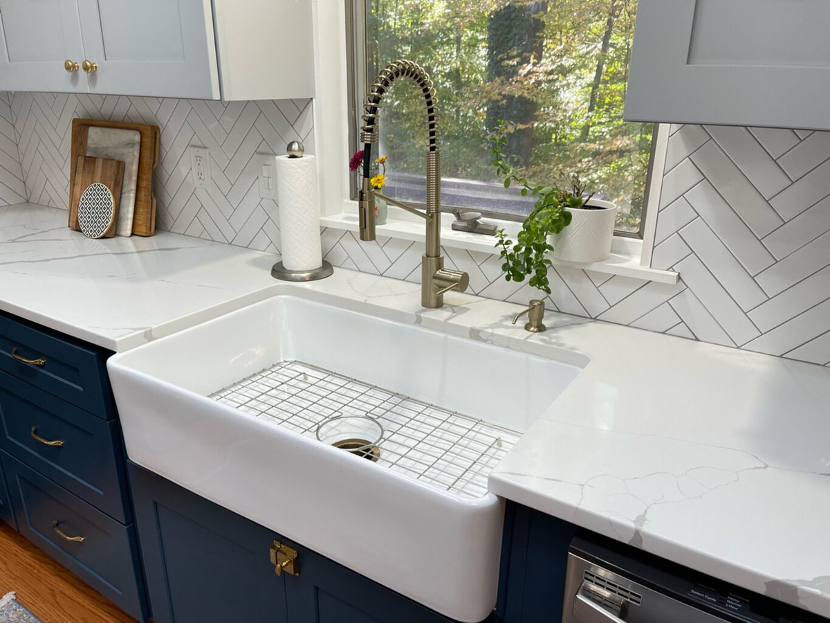 Clean kitchen workspace with farmhouse sink and bright view in Springfield remodel by Anchor Remodel.