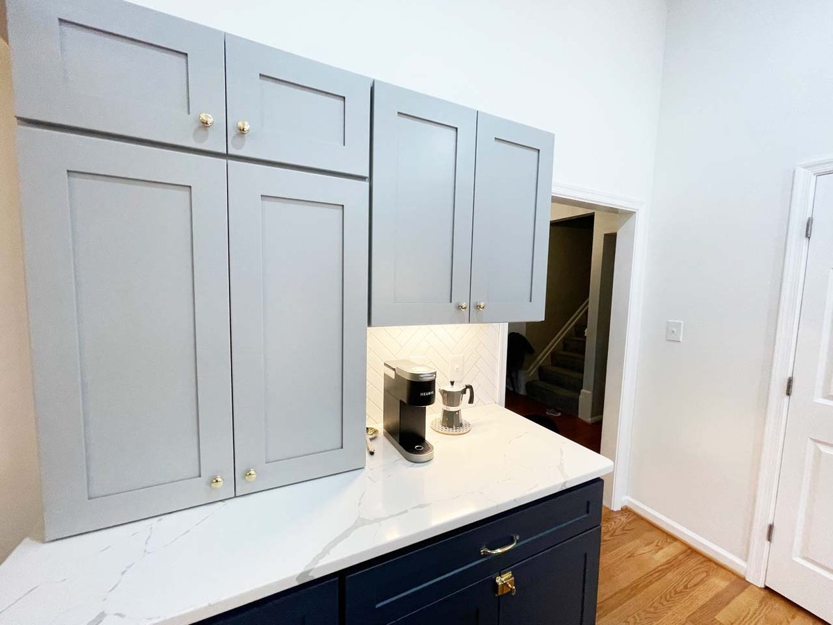Coffee bar and storage cabinets in custom kitchen remodel by Anchor Remodel in Springfield, VA.