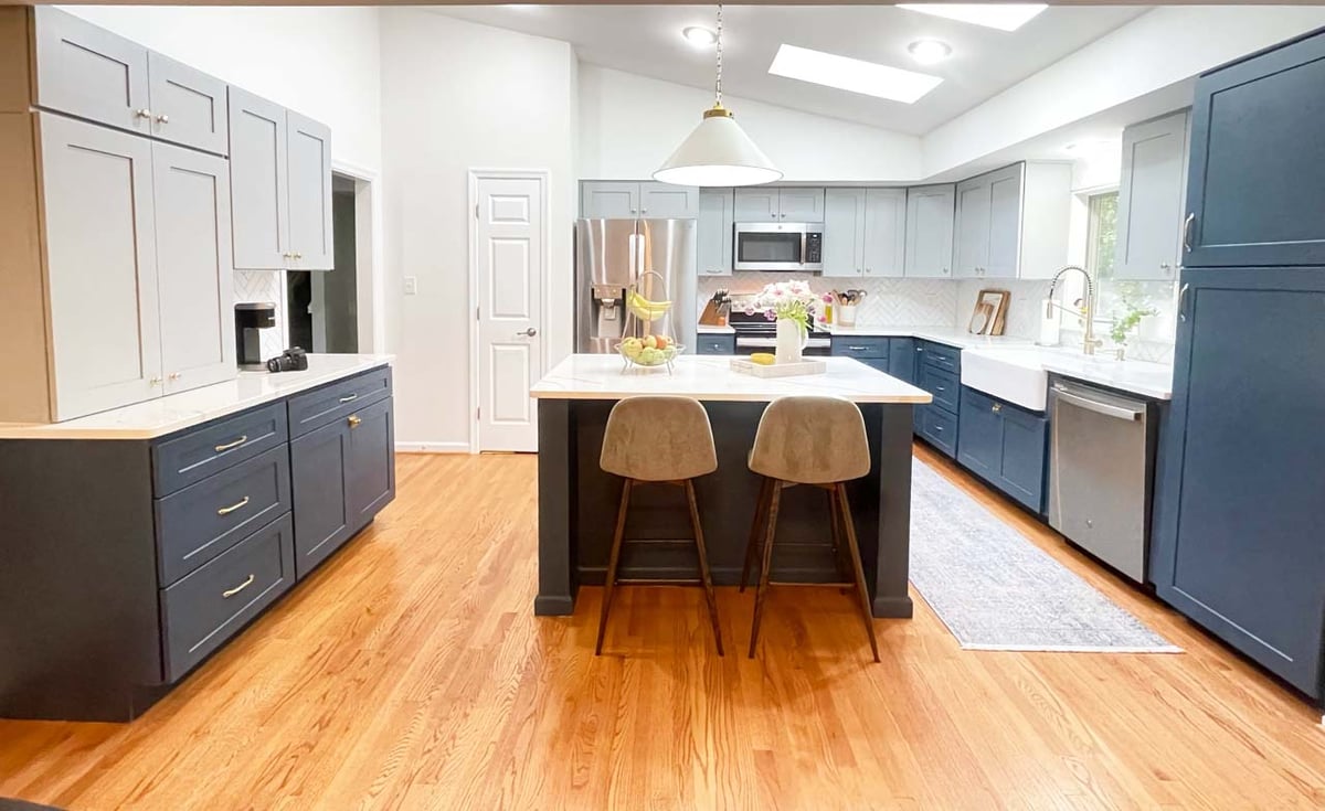 Full kitchen remodel with island, pendant light, and ample storage by Anchor Remodel in Springfield, VA.
