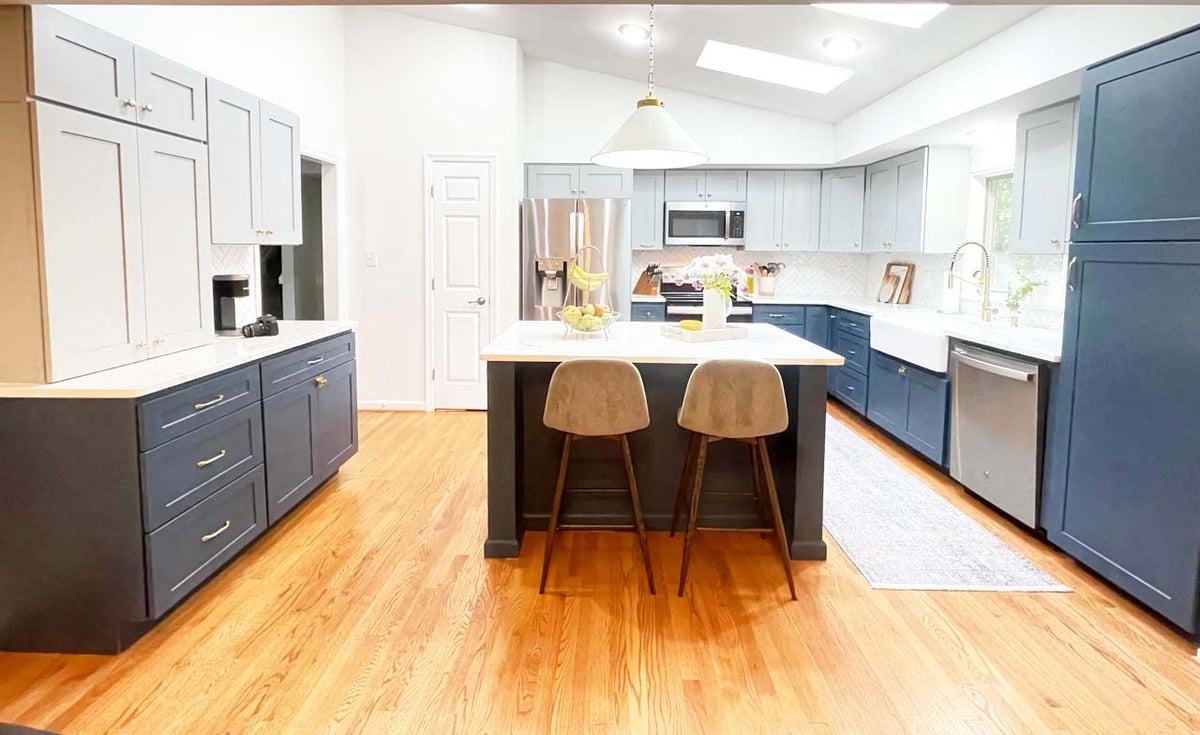 Springfield kitchen remodel by Anchor Remodel with navy lower cabinets and gray uppers.