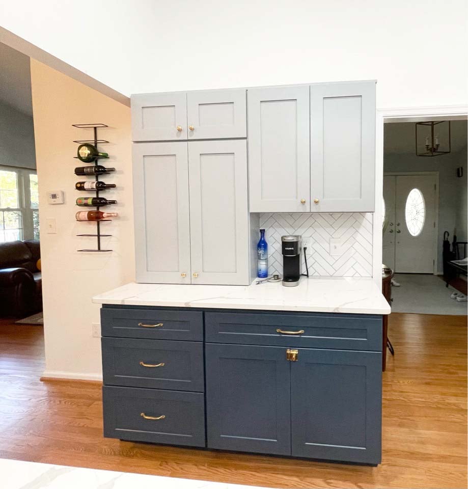 Upper and lower cabinets in navy and gray from Springfield custom kitchen remodel by Anchor Remodel.