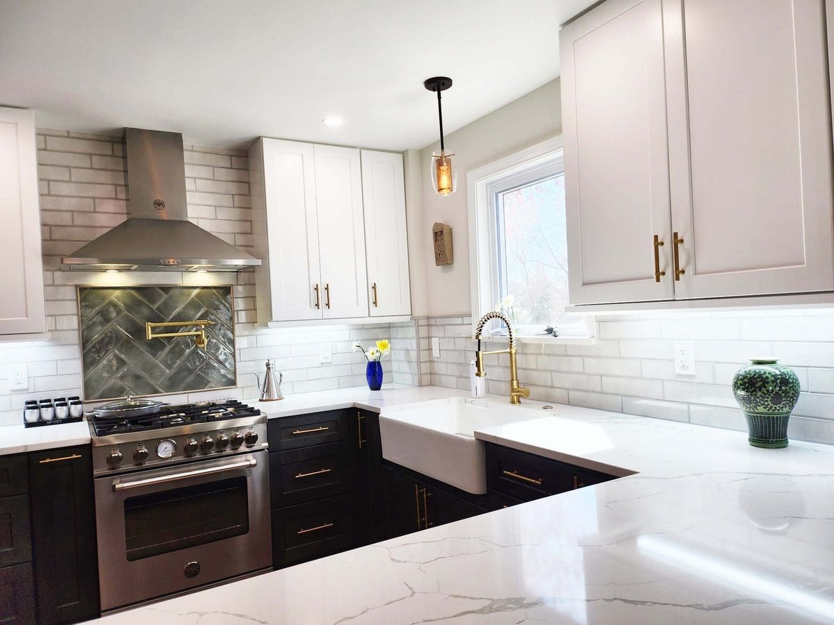 Close-up of custom kitchen corner with farmhouse sink and stainless steel range by Anchor Remodel in Alexandria, VA