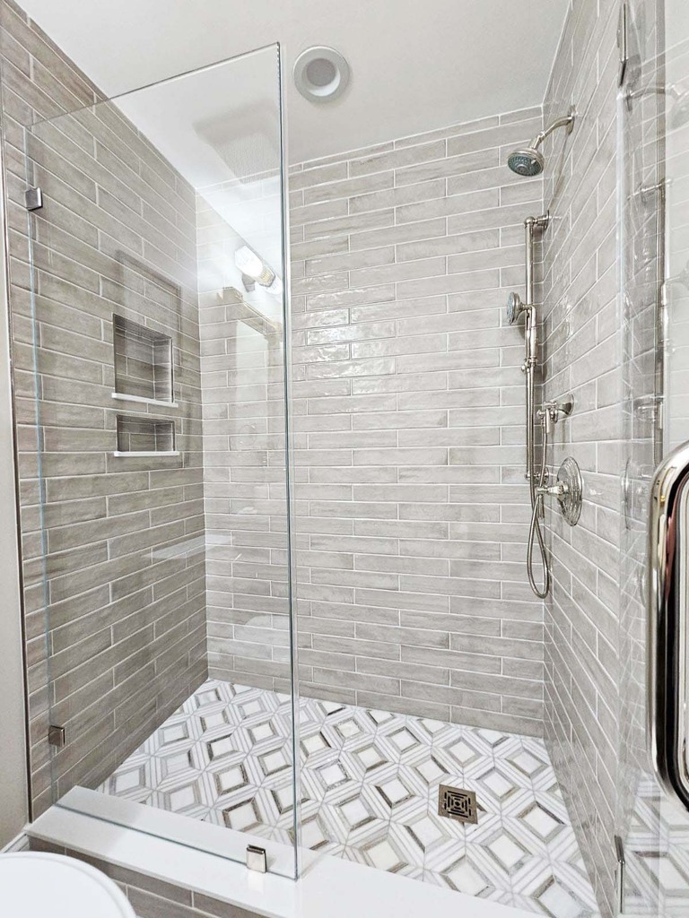 Anchor Remodel walk-in shower with glass enclosure and modern fixtures in Leesburg, VA.